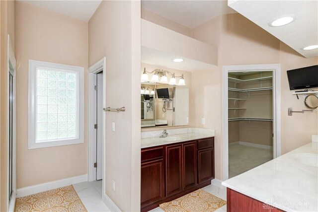 2082 Tamarack Ridge Ct, Beavercreek, OH 45431 - full bathroom with vanity, a walk in closet, and tile patterned floors