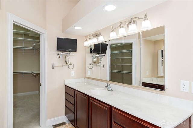 2082 Tamarack Ridge Ct, Beavercreek, OH 45431 - bathroom with vanity and a spacious closet