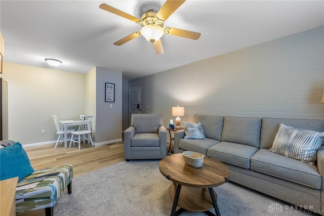 2225 Coach Dr Unit 29A, Kettering, OH 45440 - living room featuring a ceiling fan, wood finished floors, and baseboards