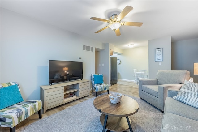 2225 Coach Dr Unit 29A, Kettering, OH 45440 - living room featuring wood finished floors, a ceiling fan, and baseboards