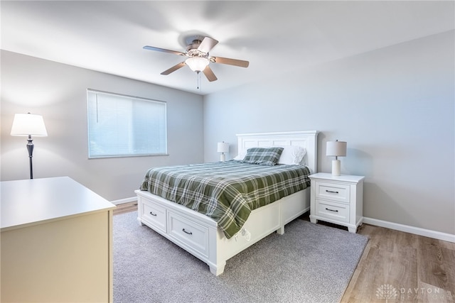 2225 Coach Dr Unit 29A, Kettering, OH 45440 - bedroom featuring light wood finished floors, baseboards, and ceiling fan