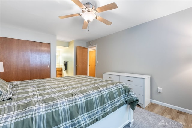 2225 Coach Dr Unit 29A, Kettering, OH 45440 - bedroom featuring light wood-type flooring, baseboards, ceiling fan, and a closet