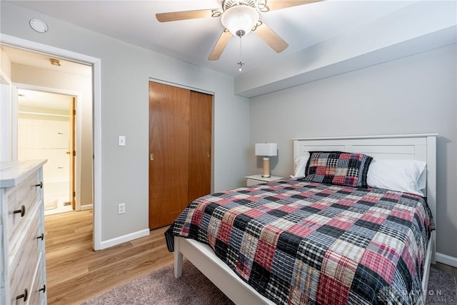2225 Coach Dr Unit 29A, Kettering, OH 45440 - bedroom featuring light wood-style floors, baseboards, a ceiling fan, and a closet