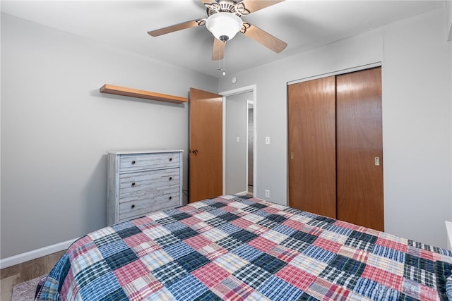 2225 Coach Dr Unit 29A, Kettering, OH 45440 - bedroom featuring wood finished floors, a closet, baseboards, and ceiling fan