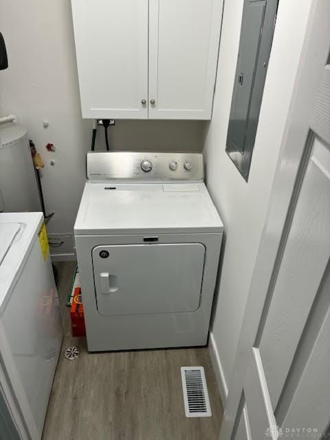 8722 Washington Colony Dr, Dayton, OH 45458 - washroom with cabinet space, electric panel, wood finished floors, and washing machine and clothes dryer