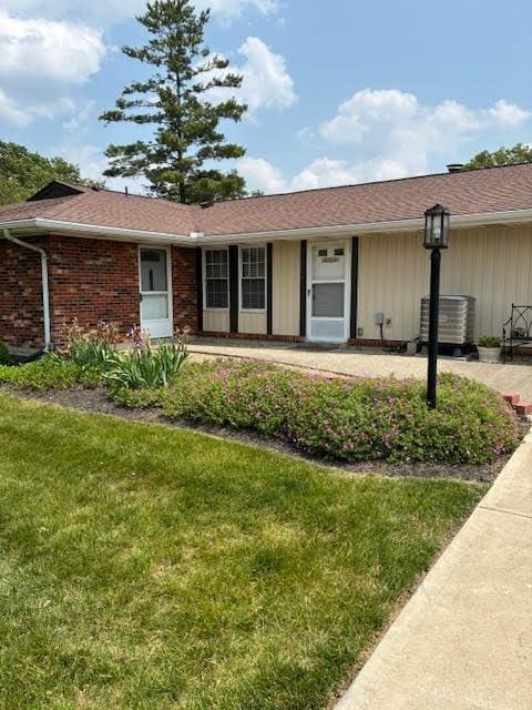 8722 Washington Colony Dr, Dayton, OH 45458 - single story home featuring a front lawn and brick siding
