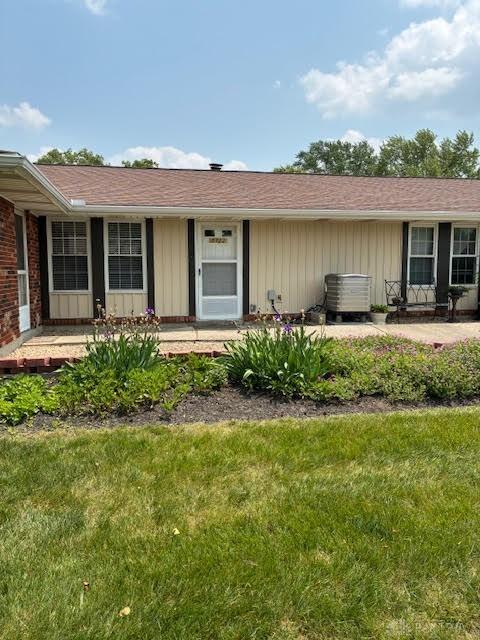 8722 Washington Colony Dr, Dayton, OH 45458 - view of exterior entry with a yard