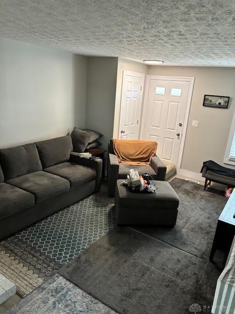 8722 Washington Colony Dr, Dayton, OH 45458 - living area featuring a textured ceiling