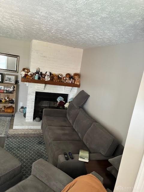 8722 Washington Colony Dr, Dayton, OH 45458 - living room with a textured ceiling and a fireplace