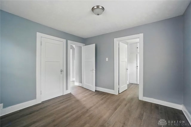 123 Delaware Ave, Dayton, OH 45405 - unfurnished bedroom featuring baseboards and wood finished floors