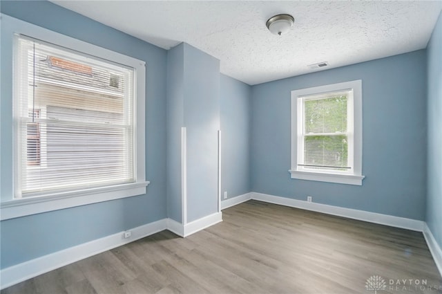 123 Delaware Ave, Dayton, OH 45405 - empty room featuring wood finished floors and a textured ceiling