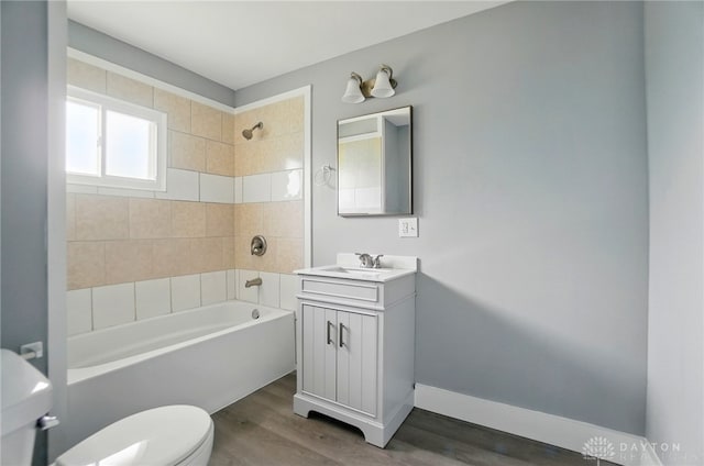 123 Delaware Ave, Dayton, OH 45405 - bathroom with bathtub / shower combination, vanity, and wood finished floors