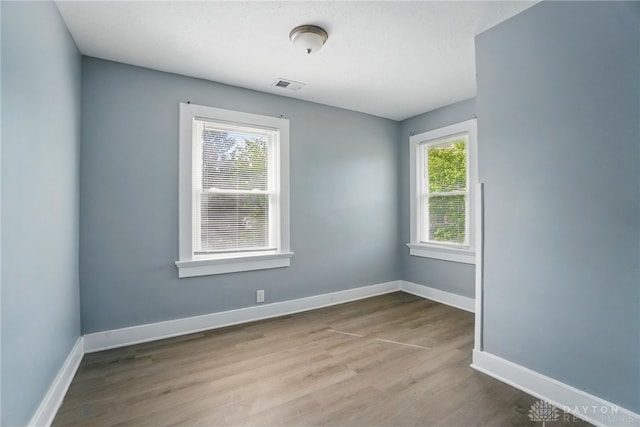 123 Delaware Ave, Dayton, OH 45405 - unfurnished room with wood finished floors and baseboards