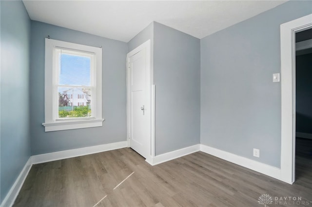 123 Delaware Ave, Dayton, OH 45405 - unfurnished bedroom with wood finished floors and baseboards