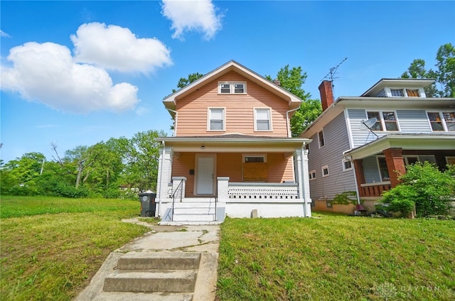 123 Delaware Ave, Dayton, OH 45405 - american foursquare style home featuring a porch and a front yard