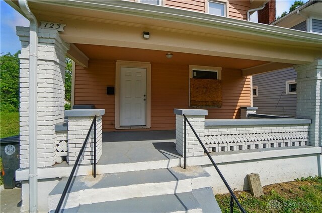 123 Delaware Ave, Dayton, OH 45405 - doorway to property featuring covered porch