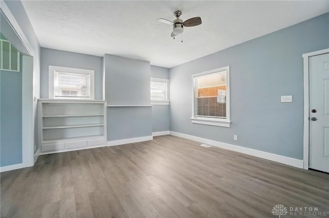 123 Delaware Ave, Dayton, OH 45405 - empty room with a ceiling fan, healthy amount of natural light, and wood finished floors