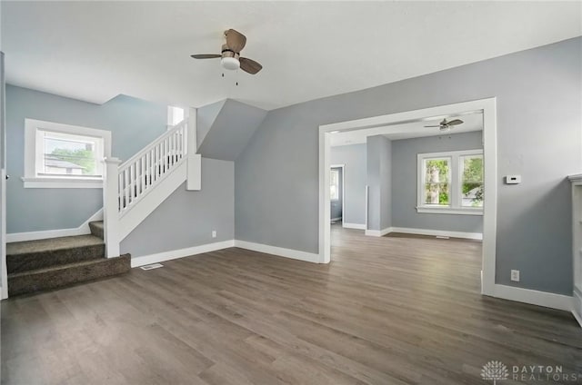 123 Delaware Ave, Dayton, OH 45405 - unfurnished living room with ceiling fan, wood finished floors, and stairway