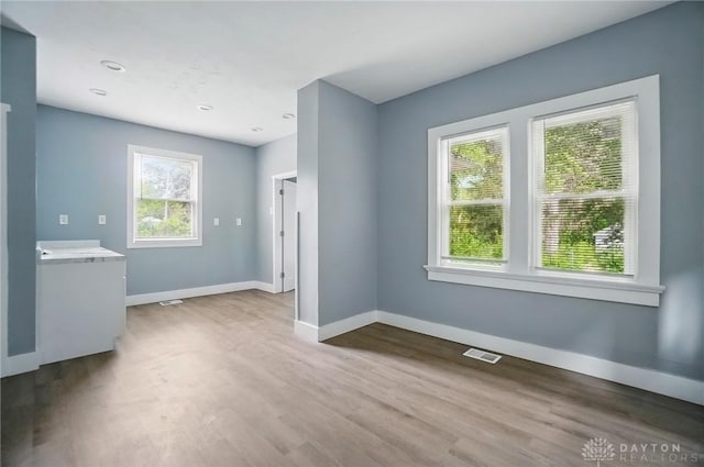 123 Delaware Ave, Dayton, OH 45405 - unfurnished dining area featuring baseboards and wood finished floors