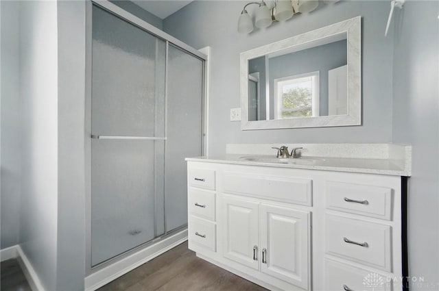 123 Delaware Ave, Dayton, OH 45405 - full bath featuring a shower stall, vanity, and wood finished floors