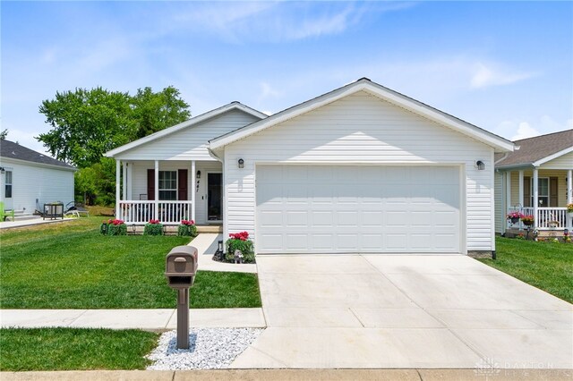441 Kalynn Cir Unit 26, Fairborn, OH 45324 - ranch-style house featuring a porch, a garage, a front yard, and driveway
