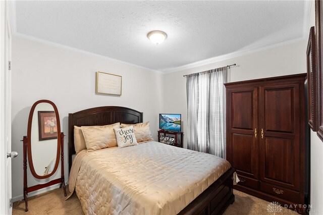 441 Kalynn Cir Unit 26, Fairborn, OH 45324 - bedroom featuring light colored carpet, ornamental molding, and a textured ceiling