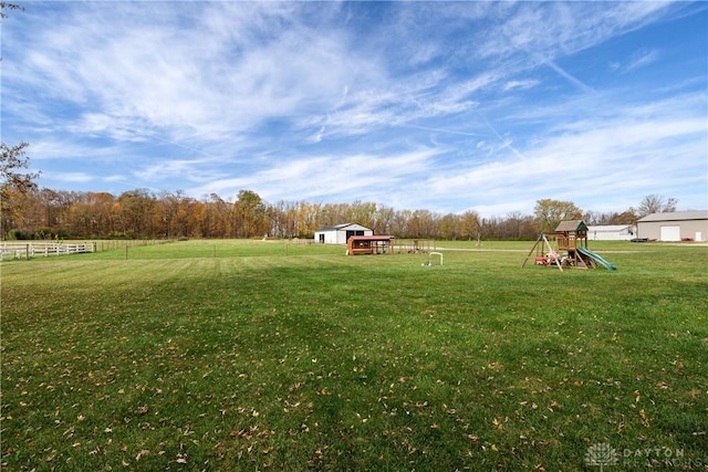 5881 Hunter Rd, Enon Vlg, OH 45323 - view of grassy yard with a playground
