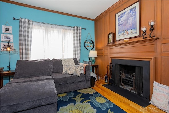 446 Lookout Rdg, Oakwood, OH 45419 - living room with ornamental molding, a fireplace with flush hearth, and wood finished floors