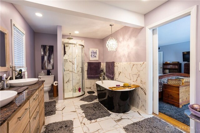 446 Lookout Rdg, Oakwood, OH 45419 - bathroom with a shower stall, tile walls, marble finish floors, double vanity, and a soaking tub