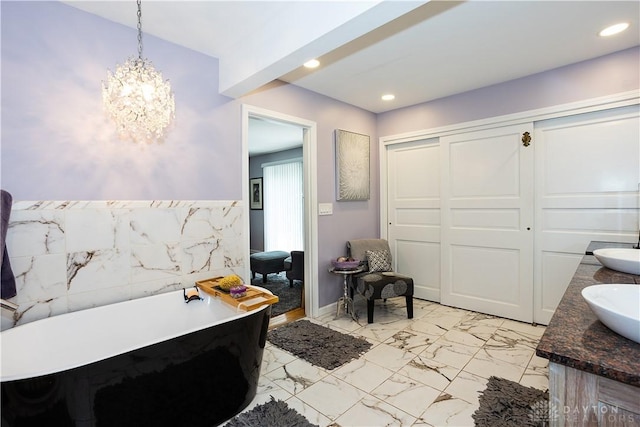 446 Lookout Rdg, Oakwood, OH 45419 - full bathroom with a soaking tub, double vanity, marble finish flooring, a chandelier, and recessed lighting