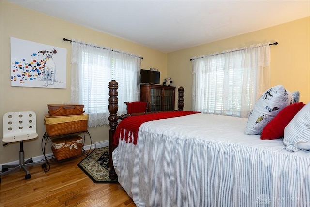 446 Lookout Rdg, Oakwood, OH 45419 - bedroom featuring multiple windows, wood finished floors, baseboards, and a baseboard radiator