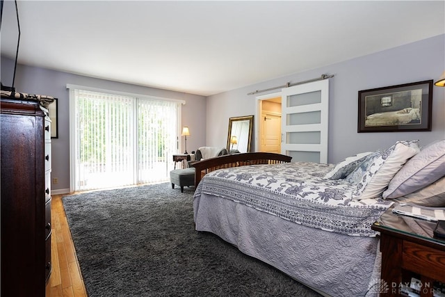 446 Lookout Rdg, Oakwood, OH 45419 - bedroom with wood finished floors and access to outside