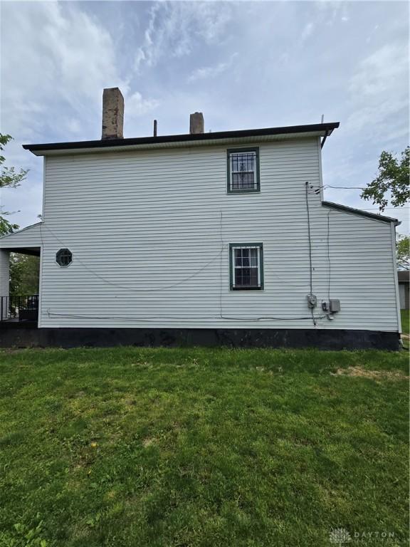 40 Gordon Ave, Dayton, OH 45402 - view of side of home with a yard and a chimney