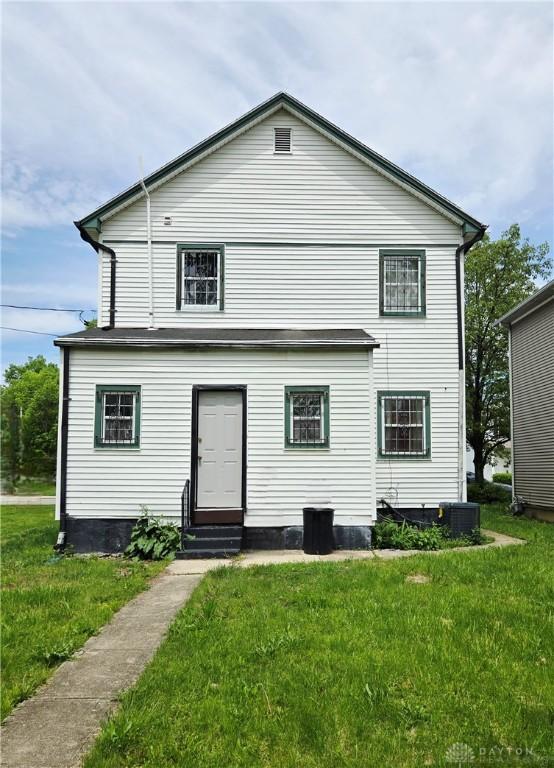 40 Gordon Ave, Dayton, OH 45402 - rear view of property featuring entry steps, a lawn, and cooling unit