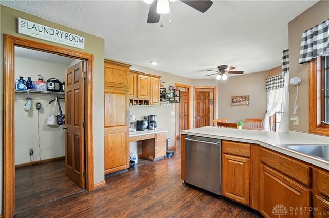5193 Horseshoe Dr, Lewisburg, OH 45338 - kitchen with stainless steel dishwasher, a ceiling fan, dark wood-style floors, light countertops, and a textured ceiling