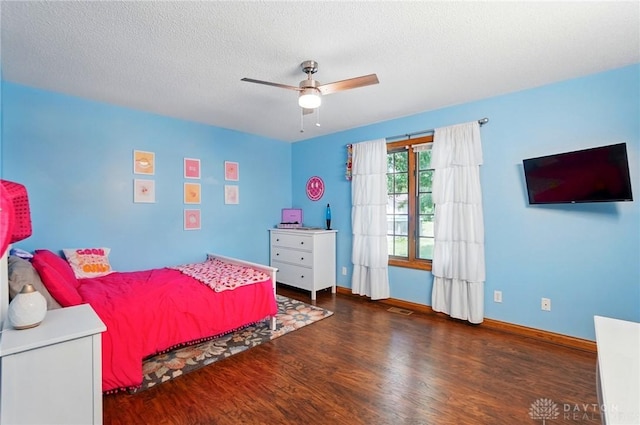 5193 Horseshoe Dr, Lewisburg, OH 45338 - bedroom with wood finished floors, baseboards, a ceiling fan, and a textured ceiling