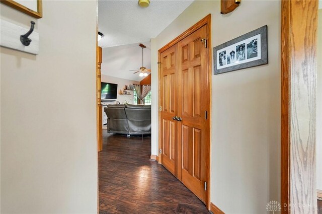 5193 Horseshoe Dr, Lewisburg, OH 45338 - corridor with dark wood-type flooring and lofted ceiling
