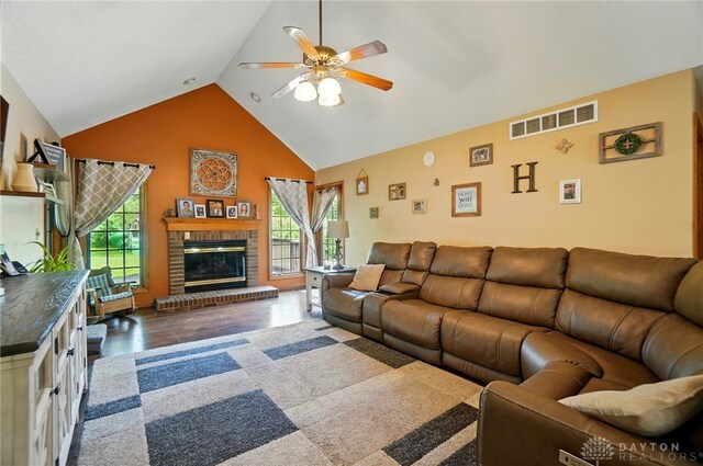 5193 Horseshoe Dr, Lewisburg, OH 45338 - living area with a ceiling fan, wood finished floors, a fireplace, and high vaulted ceiling