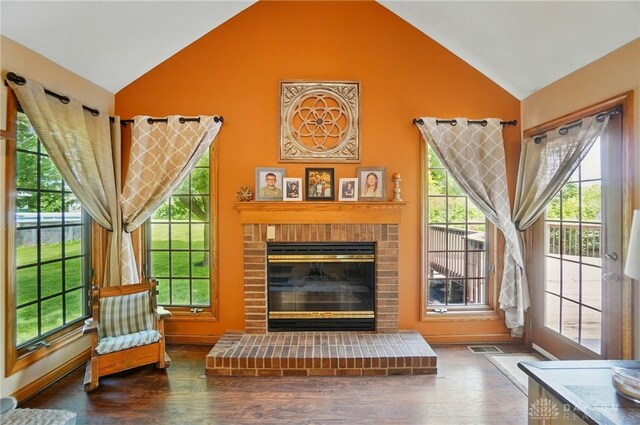 5193 Horseshoe Dr, Lewisburg, OH 45338 - living room with high vaulted ceiling, a fireplace, wood finished floors, and baseboards