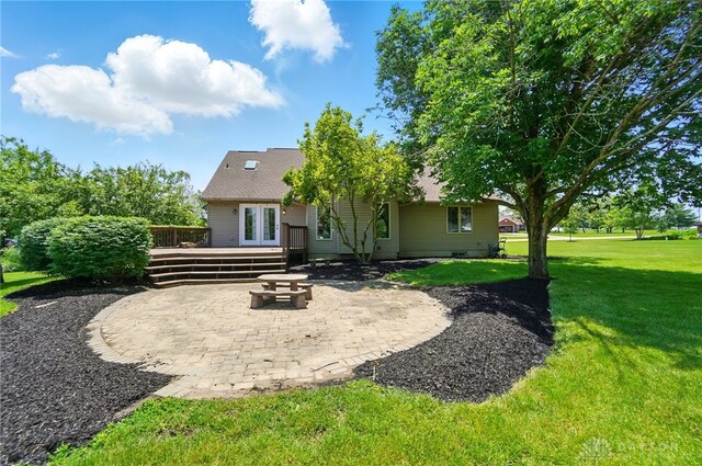5193 Horseshoe Dr, Lewisburg, OH 45338 - back of property featuring a patio, a wooden deck, a lawn, and french doors