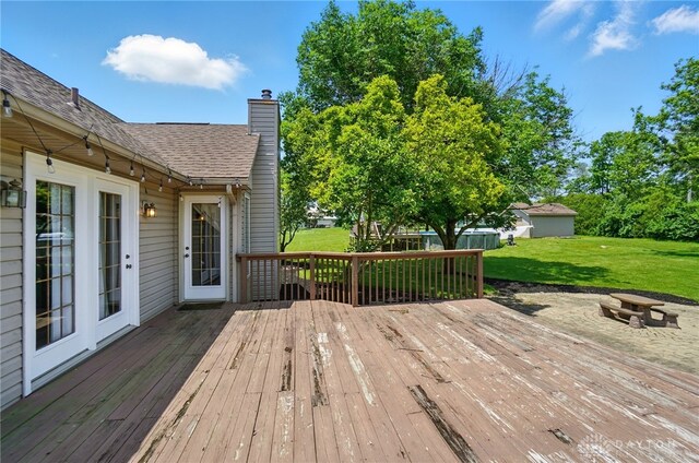 5193 Horseshoe Dr, Lewisburg, OH 45338 - deck with a fire pit and a yard