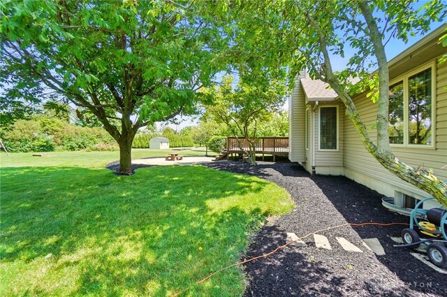 5193 Horseshoe Dr, Lewisburg, OH 45338 - view of green lawn featuring a deck