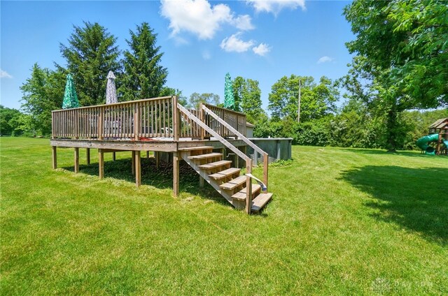 5193 Horseshoe Dr, Lewisburg, OH 45338 - view of green lawn with a wooden deck