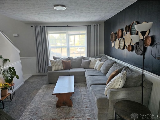 1147 Spegele Ct, Xenia, OH 45385 - carpeted living area with wainscoting and a textured ceiling