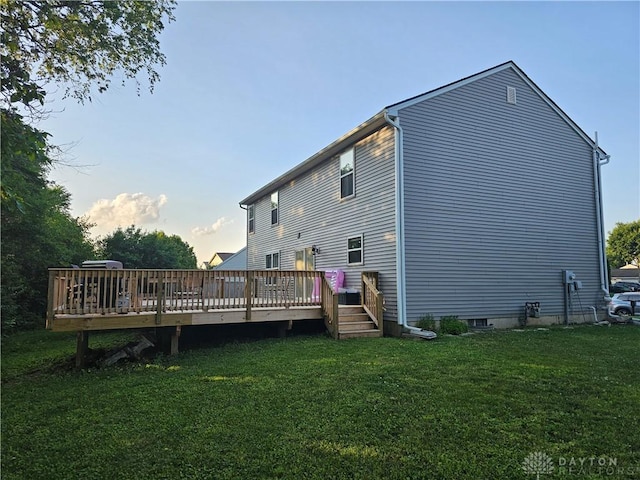 1147 Spegele Ct, Xenia, OH 45385 - back of property at dusk with a wooden deck and a lawn