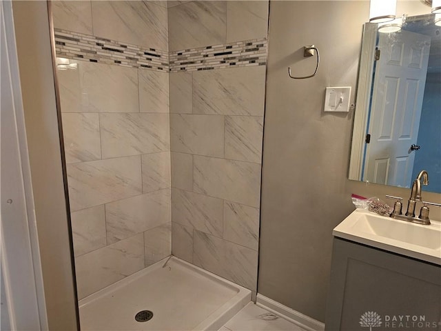 1147 Spegele Ct, Xenia, OH 45385 - full bathroom with a tile shower, marble finish flooring, and vanity