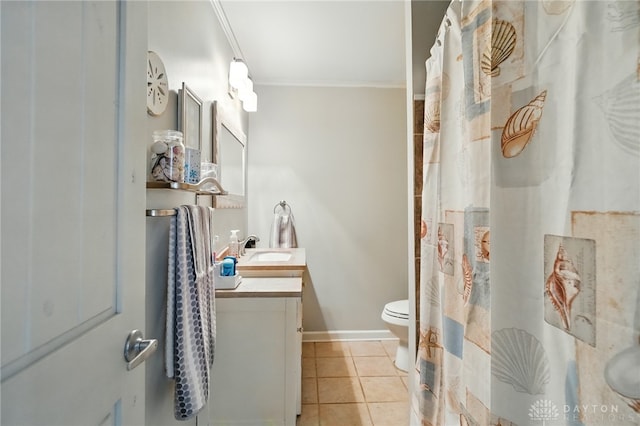 646 Barnhart Rd, Troy, OH 45373 - bathroom featuring toilet, vanity, ornamental molding, tile patterned flooring, and baseboards