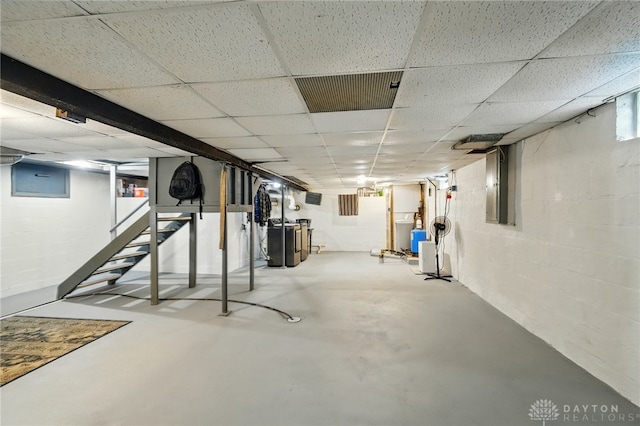 646 Barnhart Rd, Troy, OH 45373 - basement featuring a drop ceiling, concrete block wall, and electric panel
