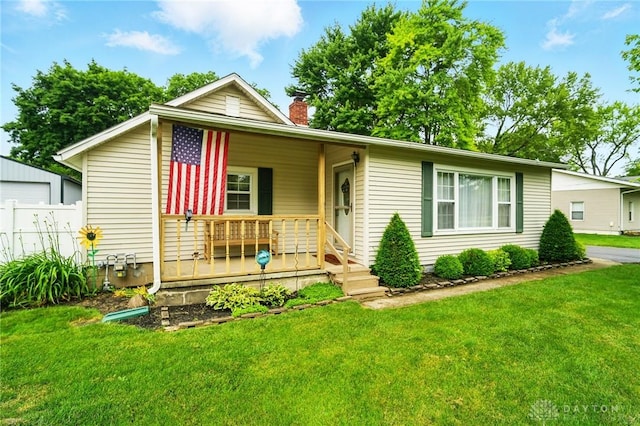 646 Barnhart Rd, Troy, OH 45373 - single story home with covered porch, a chimney, and a front yard