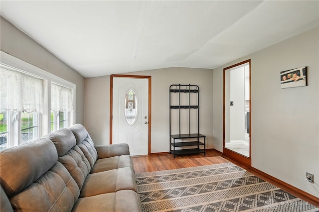 646 Barnhart Rd, Troy, OH 45373 - living room featuring vaulted ceiling, wood finished floors, and baseboards